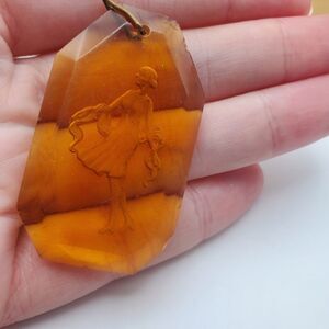 1920s flapper dancer in carved amber necklace pendant art deco zcech period piec